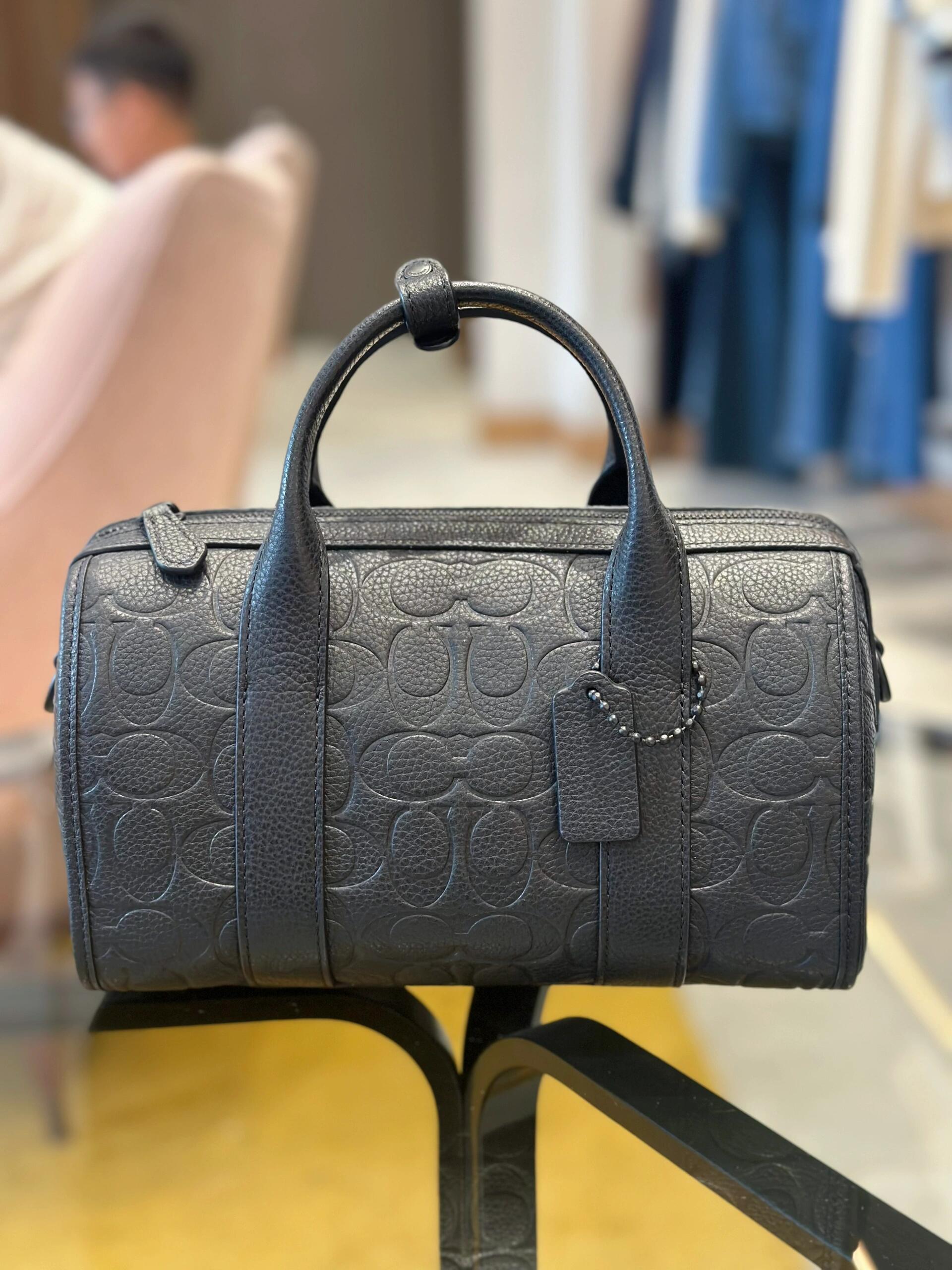 COACH Embossed Signature Barrel Handbag